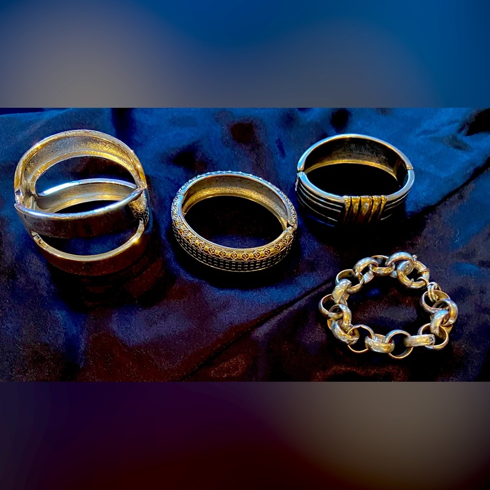 Bundle of 4 silver tone bracelets.